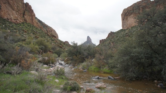 crossing a creek in the superstition wilderness after heavy rains