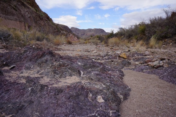cool purple colored rocks in a wash in big bend national park